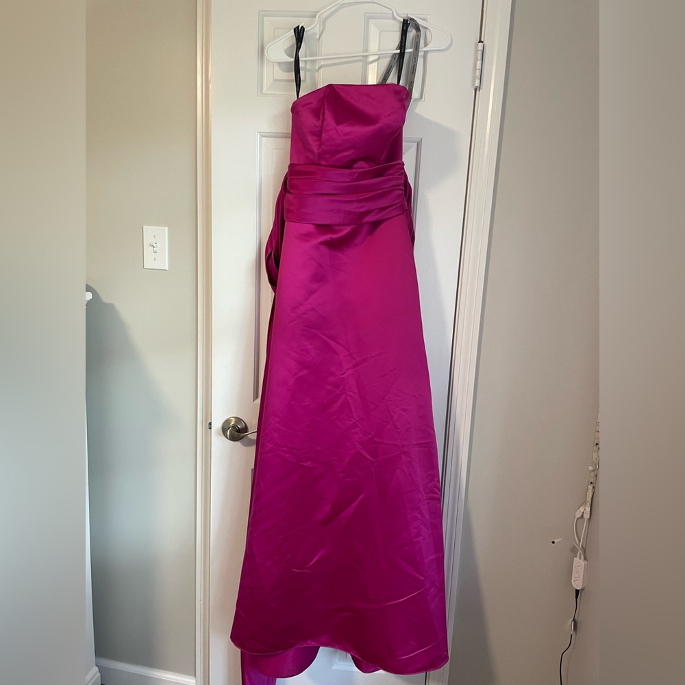 Bill Levkoff size 4 strapless pink bridesmaid dress with big pink bow.